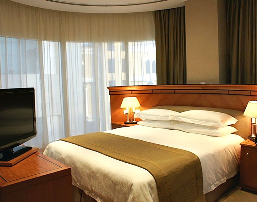 Wiseman Grand Hotel Doha Extérieur photo A bedroom in a hotel